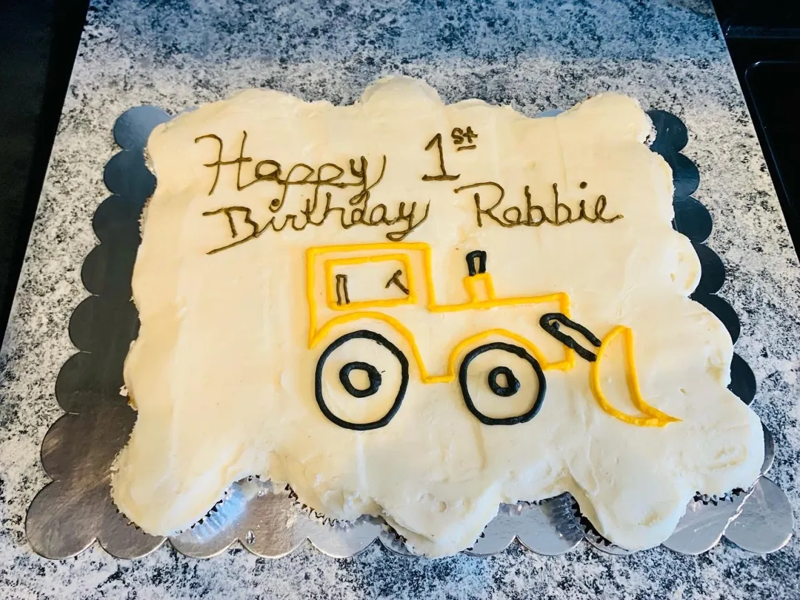 First birthday sheet cake with construction vehicle design