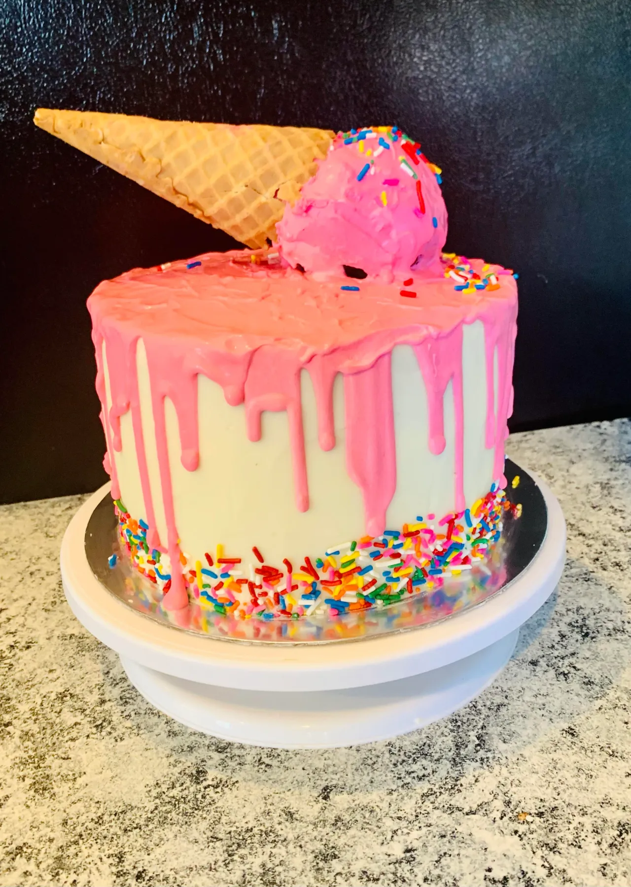Pink ice cream drip celebration cake